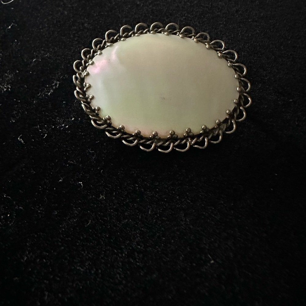 Silver and Mother of Pearl Oval Brooch with Intricate Border